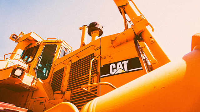 A piece of heavy machinery with the logo CAT on the side