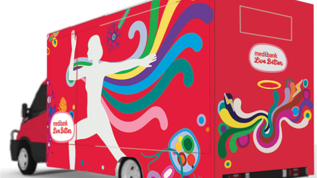 A bright red van with colourful artwork painted on it