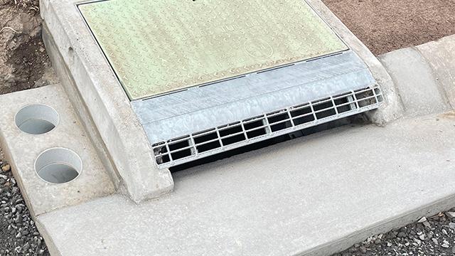 Freshly installed drainage grate 