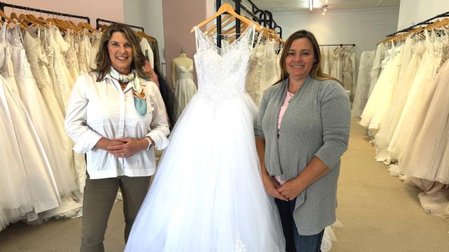 Two women standing in a bridal shop
