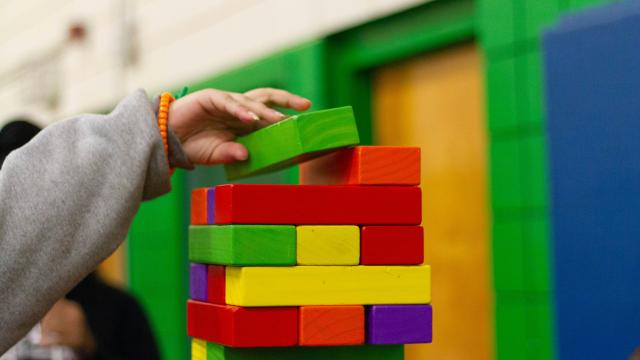 Kindergarten aged child playing with blocks
