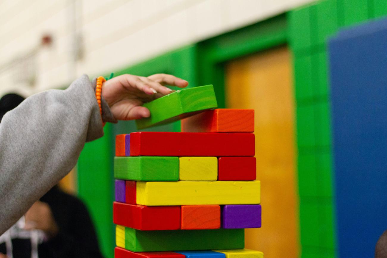 Kindergarten aged child playing with blocks